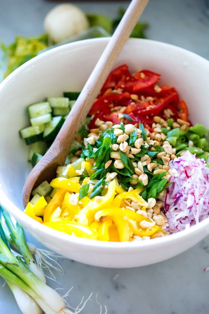 Thai Crunch Salad with mint, thai basil and scallions and a light peanut ginger dressing- vegan and gluten free| www.feastingathome.com