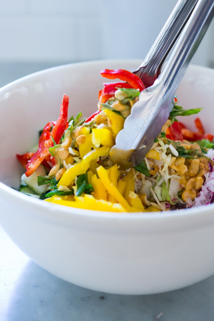 Thai Crunch Salad with mint, thai basil and scallions and a light peanut ginger dressing- vegan and gluten free| www.feastingathome.com