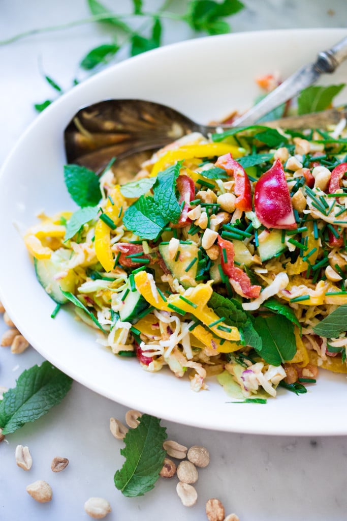 Thai Crunch Salad with Peanut Dressing is loaded up with healthy veggies, herbs and scallions. EASY, Vegan and gluten free! | www.feastingathome.com #glutenfree #vegan #thai #thaisalad #thaislaw #slaw