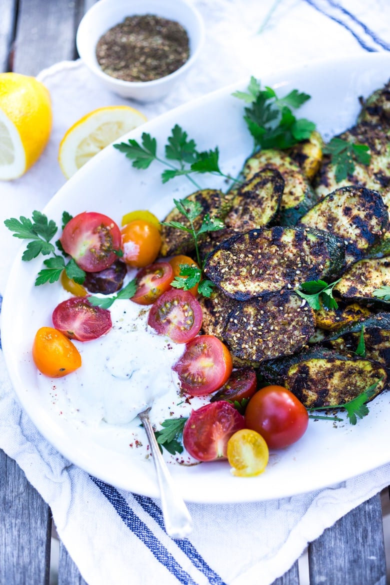 A simple recipe for Grilled Zucchini with zaatar, garlic and lemon. Serve it with a tzatziki  for extra richness. Full of flavor, delicious and healthy!  #grilledzuccini 