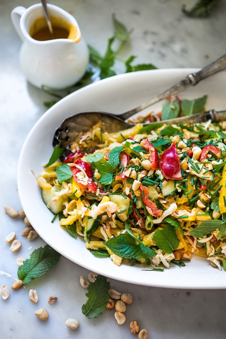 Thai Crunch Salad with Peanut Dressing is loaded up with healthy veggies, herbs and scallions. EASY, Vegan and gluten free! | www.feastingathome.com #glutenfree #vegan #thai #thaisalad #thaislaw #slaw