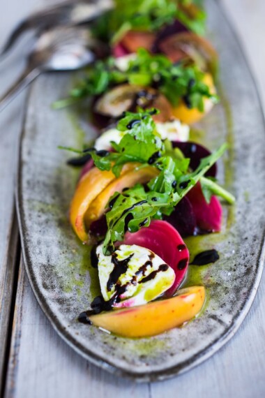 Here's a delicious Burrata Salad with beets, summer tomatoes, arugula and flavorful Basil Oil - a summery appetizer or salad, perfect for special gatherings. Elegant, healthy and oh so tasty! 