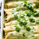 A delicious recipe for Green Enchiladas slathered in Green Enchilada Sauce. Make it with chicken or keep it vegetarian!