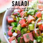 Moroccan Watermelon Salad with Cucumber, pistachios, parsley, mint, onion and crumbled feta...refreshing, simple and delicious! | www.feastingathome.com #watermelon #watermelonsalad #watermelonfetasalad #watermelonrecipes #watermelon
