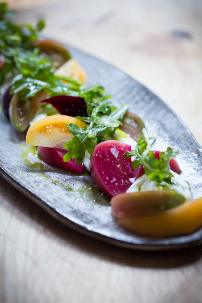 Creamy Burrata is paired with summer tomatoes, beets, and fresh basil- a delicious summery appetizer or salad, perfect for special gatherings.