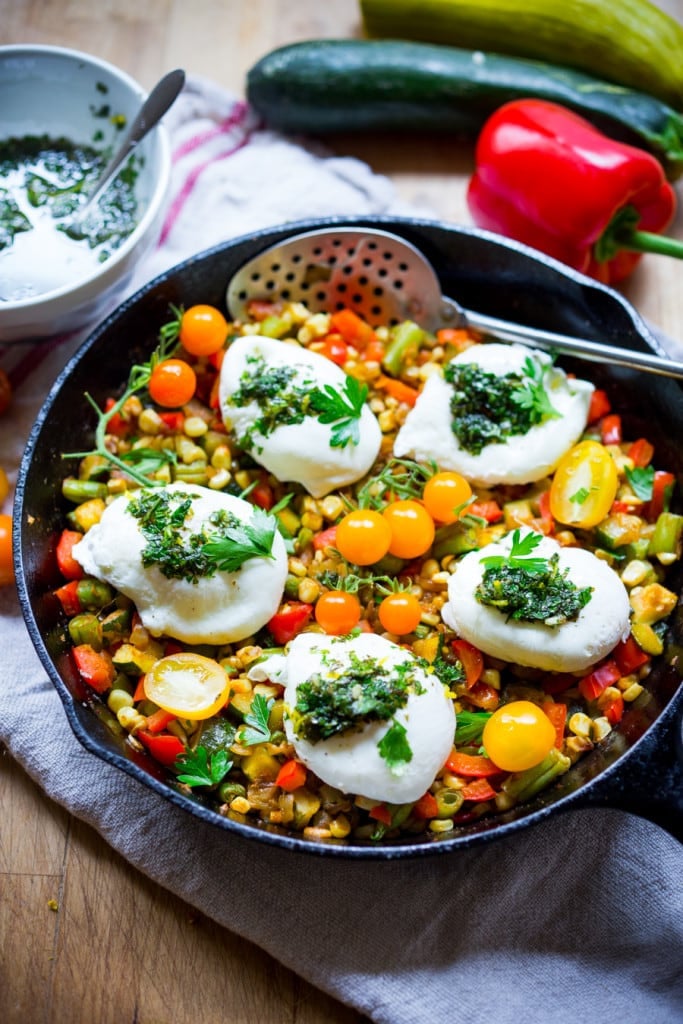 This healthy summery Breakfast Succotash is made with zucchini, corn and peppers,  then topped with pillow poached eggs and flavorful herb oil.