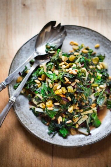 Catalan-Style, Sauteed Spinach with Garlic, Golden Raisins and Pine nuts - a simple healthy side dish that can be made in 25 minutes. 