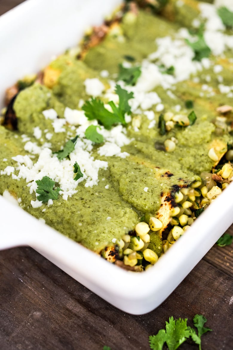 Enchiladas Verde! Chicken Enchiladas with corn and blackens in a delicious Verde Sauce. Easy and full of flavor! #enchiladas #enchiladasverde
