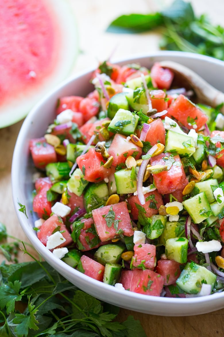 Moroccan Watermelon Salad with Cucumber, pistachios, parsley, mint, onion and crumbled feta...refreshing, simple and delicious! | www.feastingathome.com #watermelon #watermelonsalad #watermelonfetasalad #watermelonrecipes