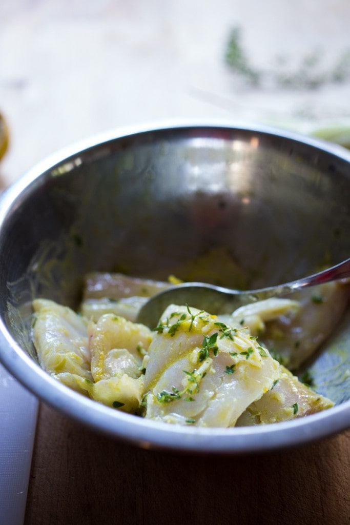 Baked haddock ( or any white fish) with roasted tomatoes , fennel, garlic, lemon and thyme. A healthy, easy one pot meal that can be made in about 35 minutes! www.feastingathome.com