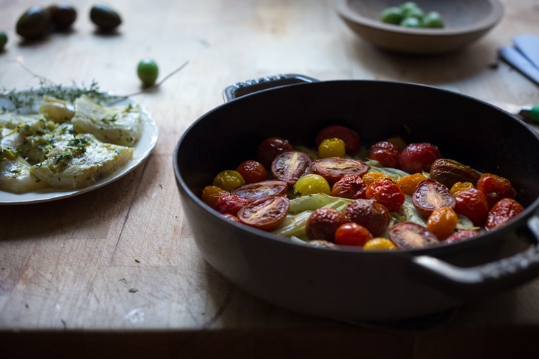 Baked haddock ( or any white fish) with roasted tomatoes , fennel, garlic, lemon and thyme. A healthy, easy one pot meal that can be made in about 35 minutes! www.feastingathome.com