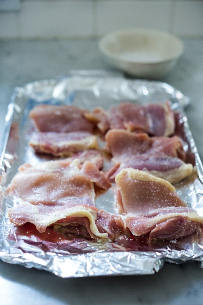 An easy recipe for simple smoked chicken, to use in tacos, enchiladas, lasagna or tossed in pasta. Can be smoked in a wok on the stove! |www.feastingathome.com
