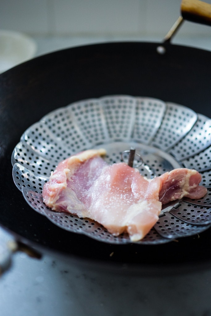 An easy recipe for simple smoked chicken, to use in tacos, enchiladas, lasagna or tossed in pasta. Can be smoked in a wok on the stove! |www.feastingathome.com