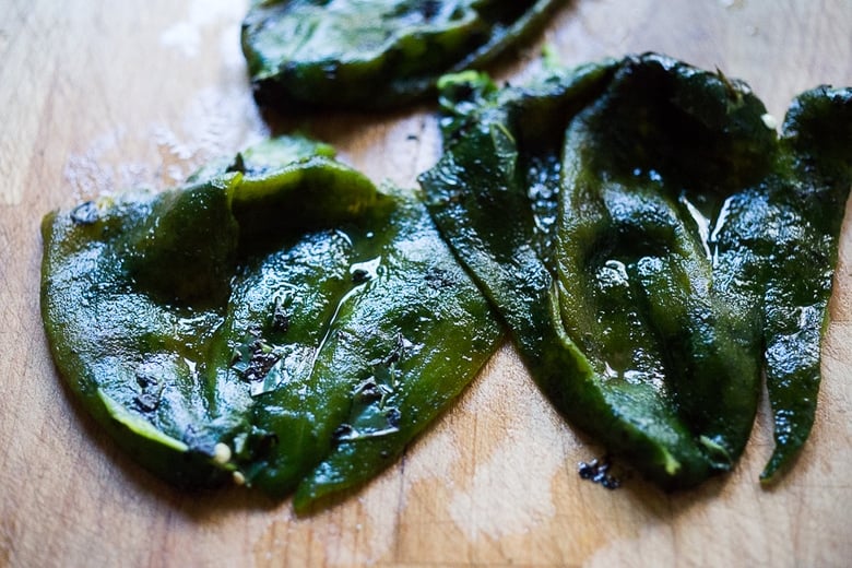 Smoked Chicken Enchiladas with sweet corn, poblanos and a vibrant flavorful Tomatillo sauce. | www.feastingathome.com