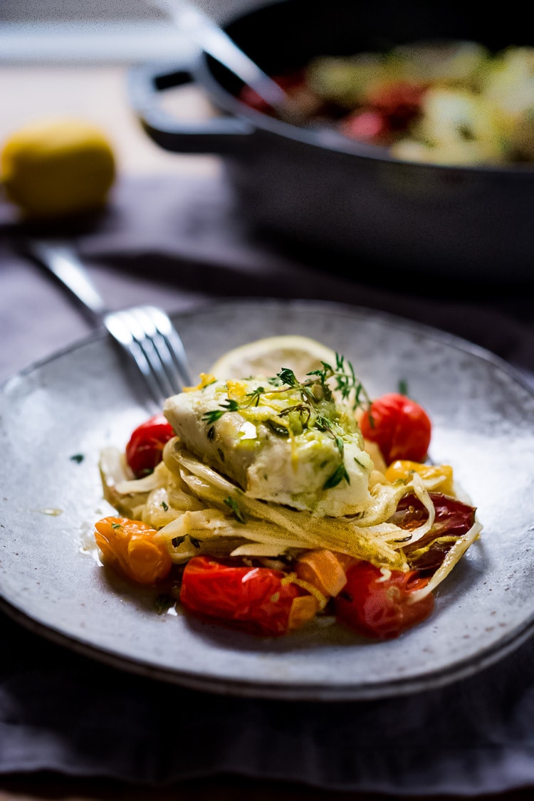 Baked Haddock with roasted tomatoes, fennel and shallots- a simple, easy, healthy one pot meal that can be made in 35 minutes! Gluten-free, Paleo, keto. #haddock #bakedhaddock 