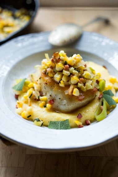 Halibut with Corn, leeks, pancetta over a lightened up Creamy Polenta| feasting at home