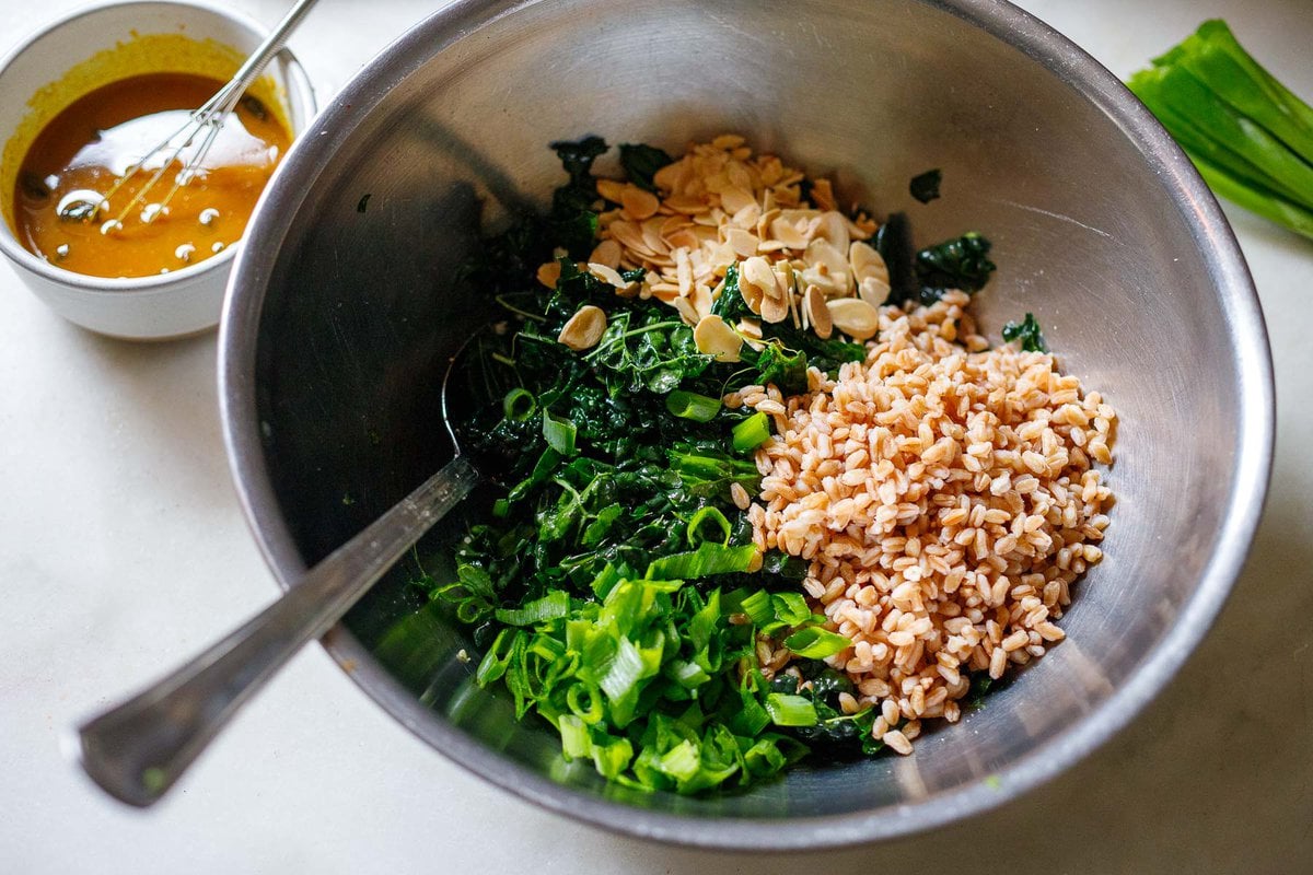 kale, farro and lamonds in a bowl. 