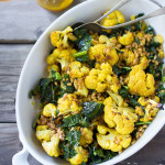 Roasted Cauliflower Farro Salad with lacinato kale and an earthy turmeric dressing. Delicious and healthy, it can be a served warm as a fall side dish, or chilled as a salad| www.feastingathom.com