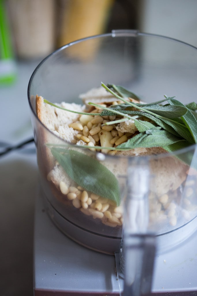 A simple delicious recipe for Velvety Cauliflower Leek Soup with Sage & Toasted Pine Nut Crumble | www.feastingathome.com