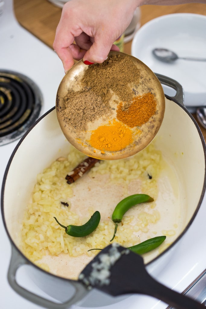 An authentic & insanely delicious recipe for Chicken Biryani with Cilantro Yogurt Sauce. Vegetarian option included as well as detailed step by step instructions. | www.feastingathome.com