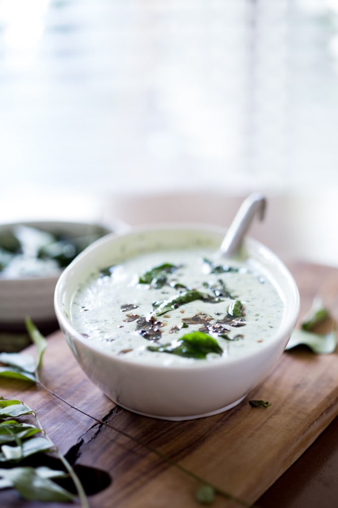 An authentic & insanely delicious recipe for Chicken Biryani with Cilantro Yogurt Sauce. Vegetarian option included as well as detailed step by step instructions. | www.feastingathome.com