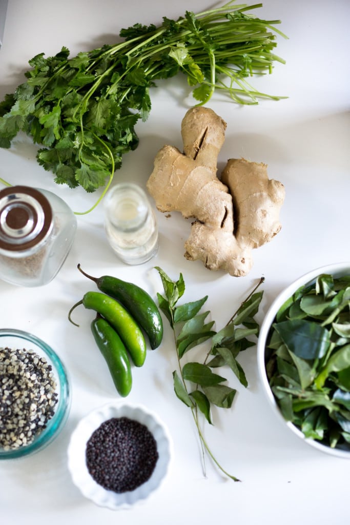 An authentic & insanely delicious recipe for Chicken Biryani with Cilantro Yogurt Sauce. Vegetarian option included as well as detailed step by step instructions. | www.feastingathome.com