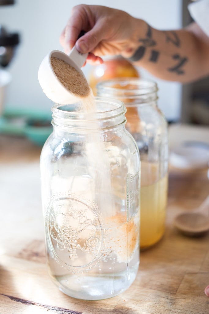 How to make Water Kefir- A simple step-by-step guide to making delicious Water Kefir, a fruit-infused, slightly fermented sparkling fruit water full of healthy probiotics, like yogurt but without the dairy! | www.feastingathome.com