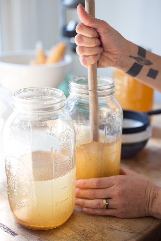 How to make Water Kefir- A simple step-by-step guide to making delicious Water Kefir, a fruit-infused, slightly fermented sparkling fruit water full of healthy probiotics, like yogurt but without the dairy! | www.feastingathome.com