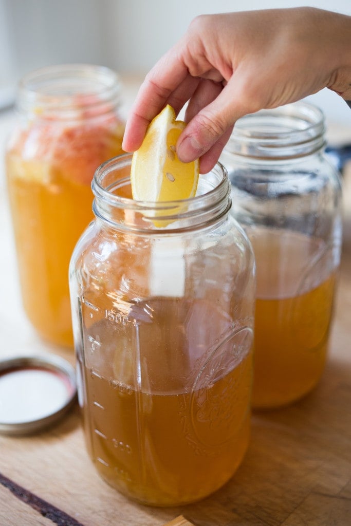 How to make Water Kefir- A simple step-by-step guide to making delicious Water Kefir, a fruit-infused, slightly fermented sparkling fruit water full of healthy probiotics, like yogurt but without the dairy! | www.feastingathome.com