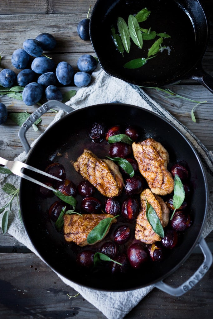 Crispy-skinned Duck with Roasted Plums, Cider Glaze and crispy sage- a simple elegant meal highlighting fall plums that can be made in 40 minutes! #duck #duckbreast #plums #roastedplums 