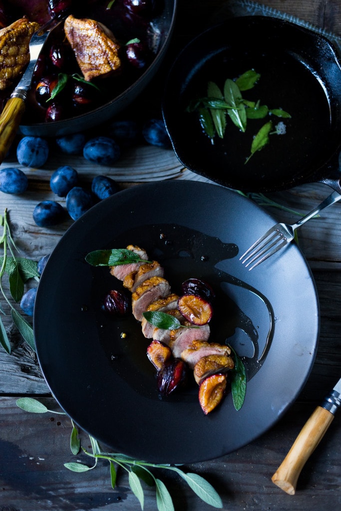 Crispy-skinned Duck with Roasted Plums, Cider Glaze and crispy sage- a simple elegant meal highlighting fall plums that can be made in 40 minutes! #duck #duckbreast #plums #roastedplums 