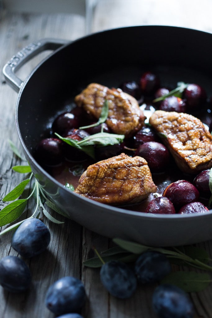 Crispy-skinned Duck with Roasted Plums, Cider Glaze and crispy sage- a simple elegant meal highlighting fall plums that can be made in 40 minutes! #duck #duckbreast #plums #roastedplums 