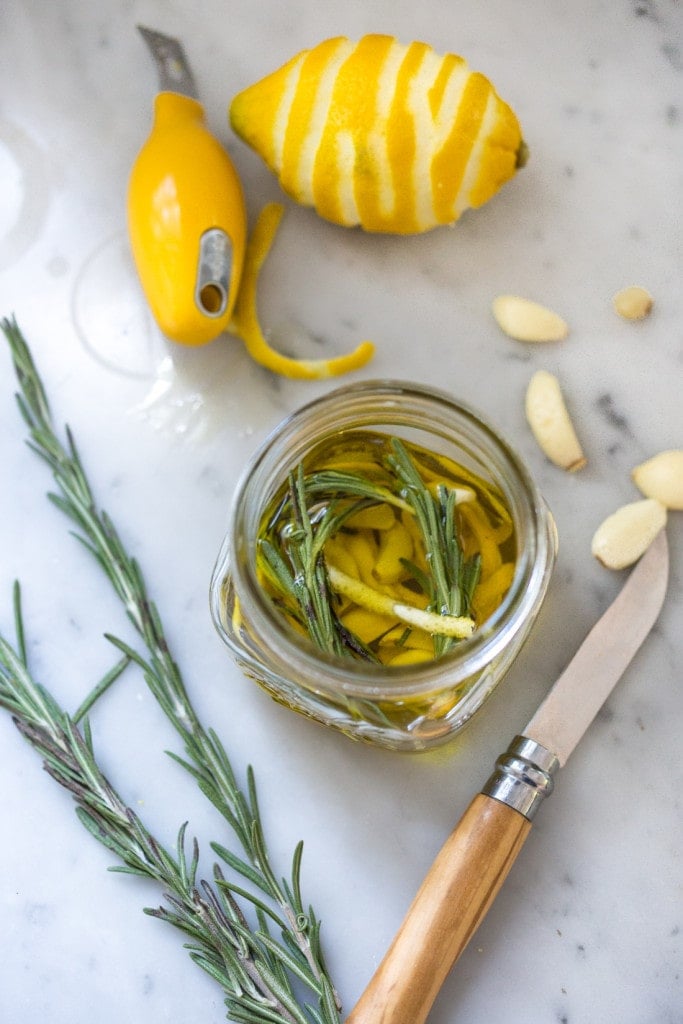 A flavorful hearty stew from Tuscany, called Ribollita with Cannellini beans, lacinato kale, and vegetables, served with crusty bread, drizzled with a Lemon Rosemary Garlic Oil. | www.feastingathome.com