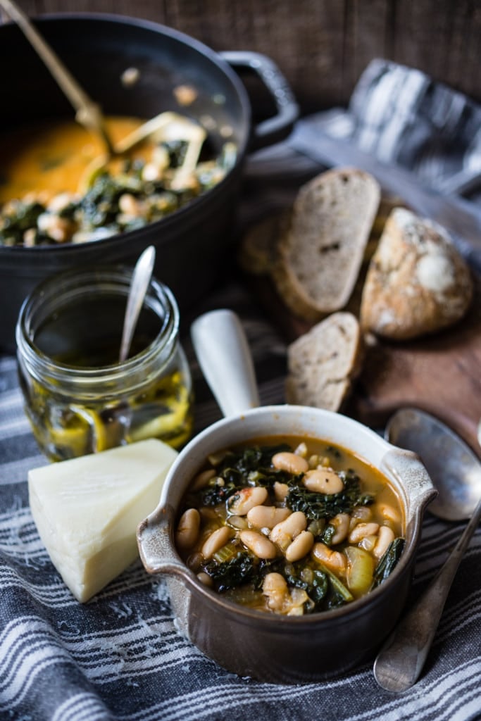 A healthy, delicious recipe for Tuscan Bean Soup called Ribollita - made with Cannellini beans, lacinato kale, and vegetables, drizzled with a Lemon Rosemary Garlic Oil. Hearty, nourishing, and easily vegan-Adaptable. (With a Video.)