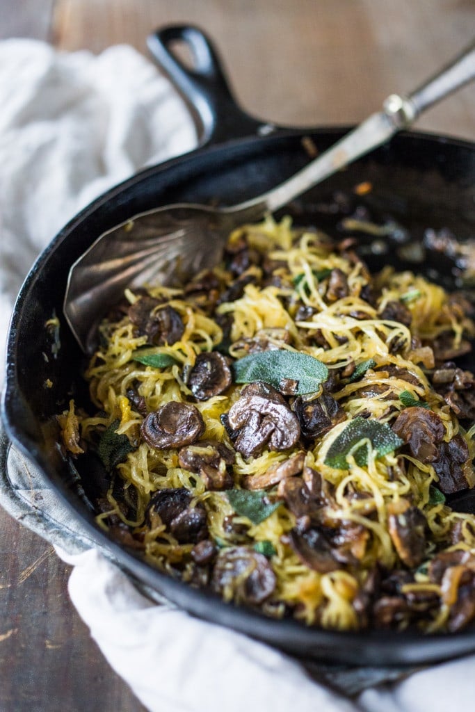 Roasted Spaghetti Squash with mushrooms, garlic and sage- a flavorful side dish, perfect for fall. Keep it vegan or add grated Romano cheese| www.feastingathome.com