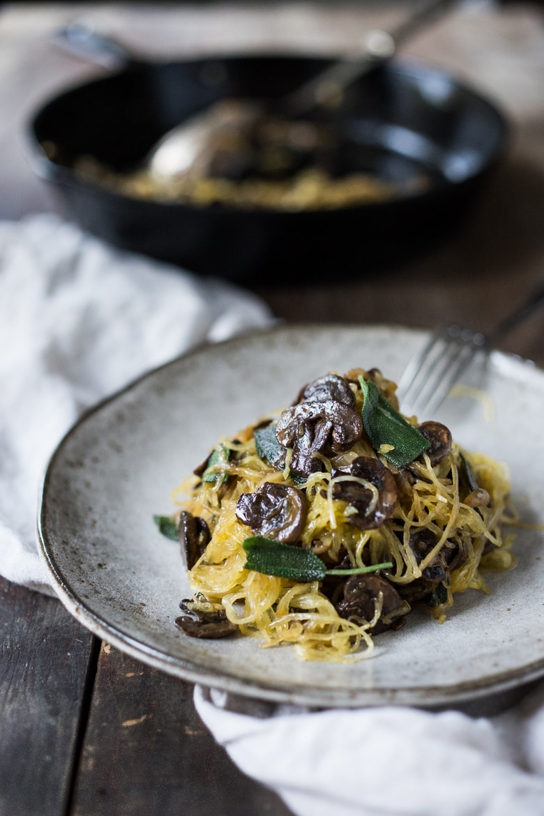 20 Healthy Pasta Recipes: Roasted Spaghetti Squash with mushrooms, garlic and sage- a flavorful and healthy low-carb meal that feels like a comforting pasta dish! Perfect for fall! Keep it vegan or add grated Romano cheese! #spaghetti squash #spaghettisquash #Paleo #keto #lowcarb #glutenfree #mushrooms #vegan