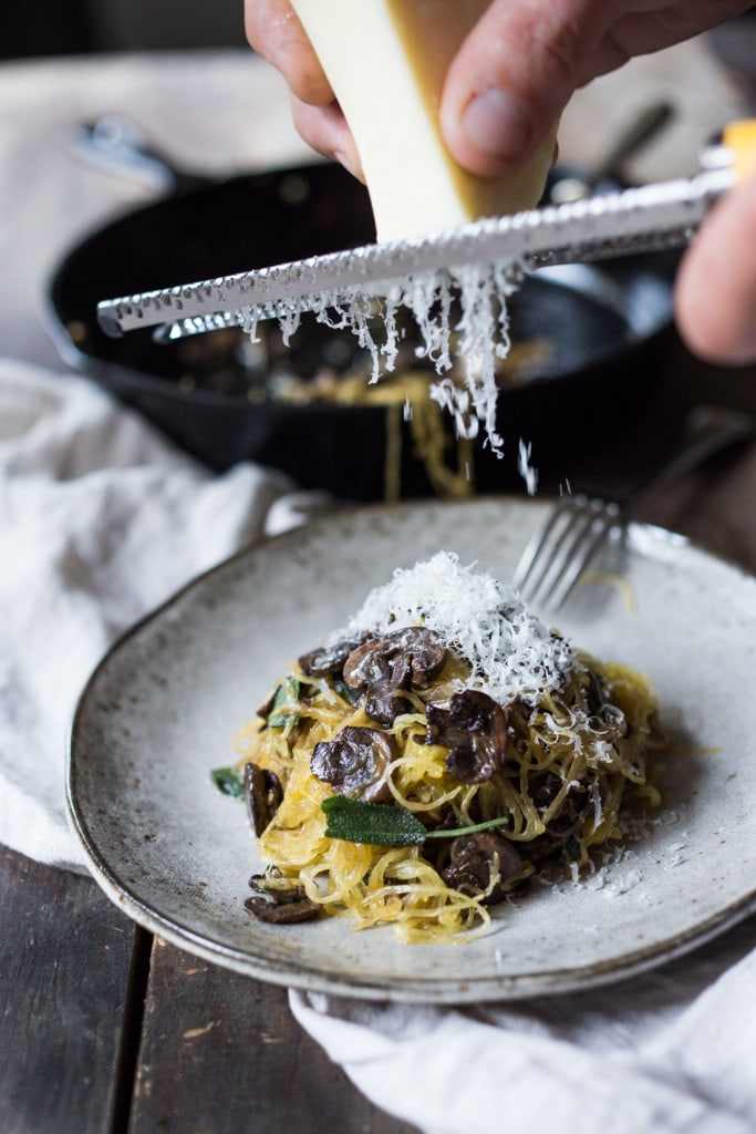 Roasted Spaghetti Squash with mushrooms, garlic and sage- a flavorful side dish, perfect for fall. Keep it vegan or add grated Romano cheese| www.feastingathome.com