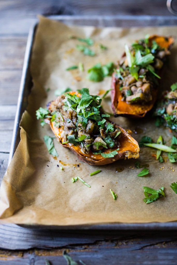 Healthy Moroccan Stuffed Sweet Potatoes w/ Ras El Hanout, chickpeas, apples, onion, garlic & cilantro is vegan, or drizzle with delicious smoked yogurt. | www.feastingathome.com @feastingathome