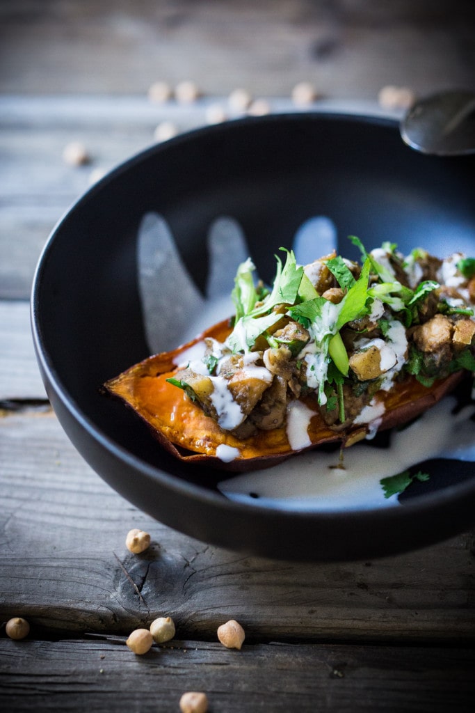 Healthy Moroccan Stuffed Sweet Potatoes w/ Ras El Hanout, chickpeas, apples, onion, garlic & cilantro is vegan, or drizzle with delicious smoked yogurt. | www.feastingathome.com @feastingathome