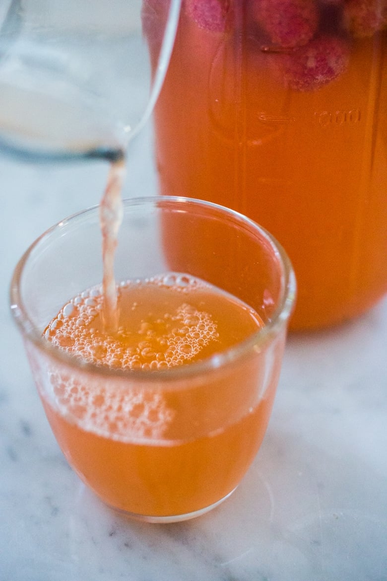 A simple step-by-step guide to making delicious Water Kefir, a fruit-infused, slightly fermented sparkling fruit water full of healthy probiotics, like yogurt but without the dairy!