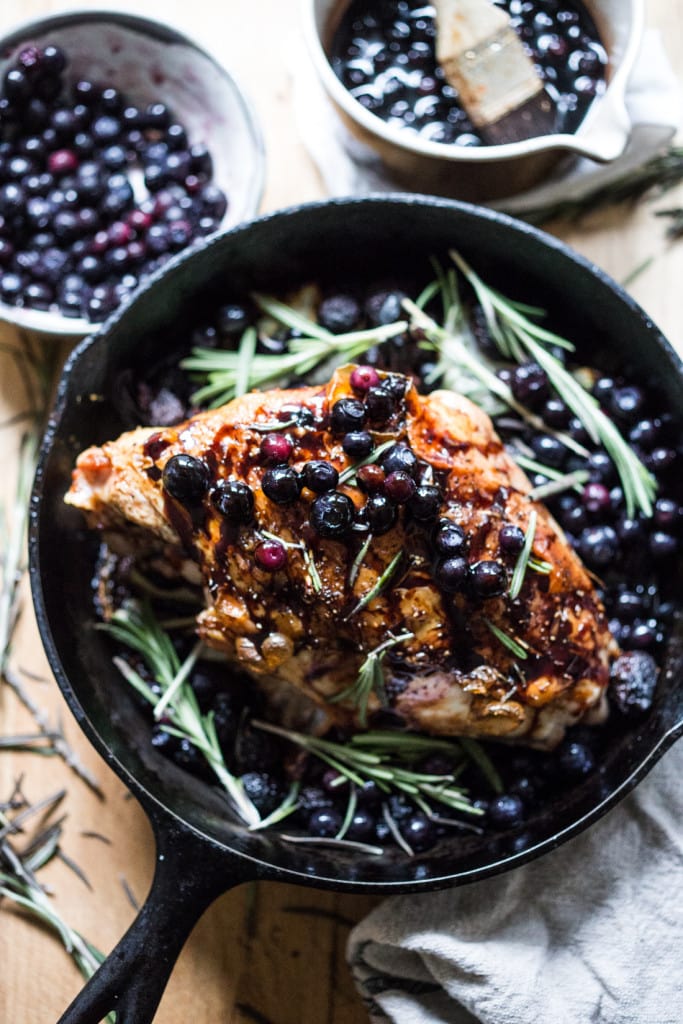 A delicious recipe for Roasted Turkey Breast with Blueberry Balsamic Glaze with whole grain mustard, dried figs, roasted blueberries and fresh rosemary sprigs. | www.feastingathome.com