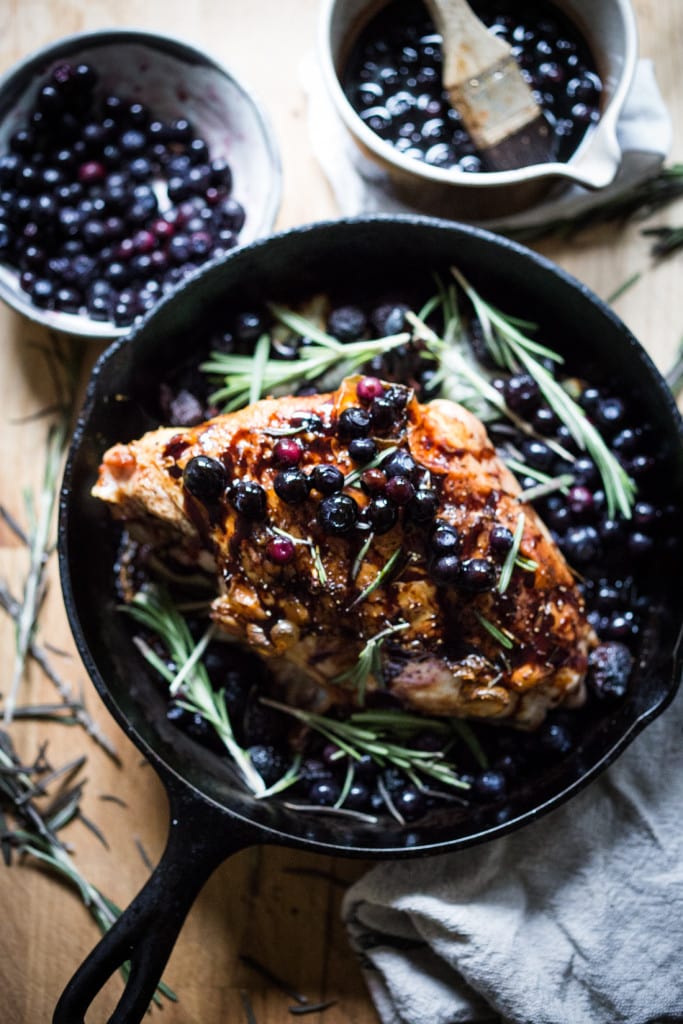 A delicious recipe for Roasted Turkey Breast with Blueberry Balsamic Glaze with whole grain mustard, dried figs, roasted blueberries and fresh rosemary sprigs. | www.feastingathome.com