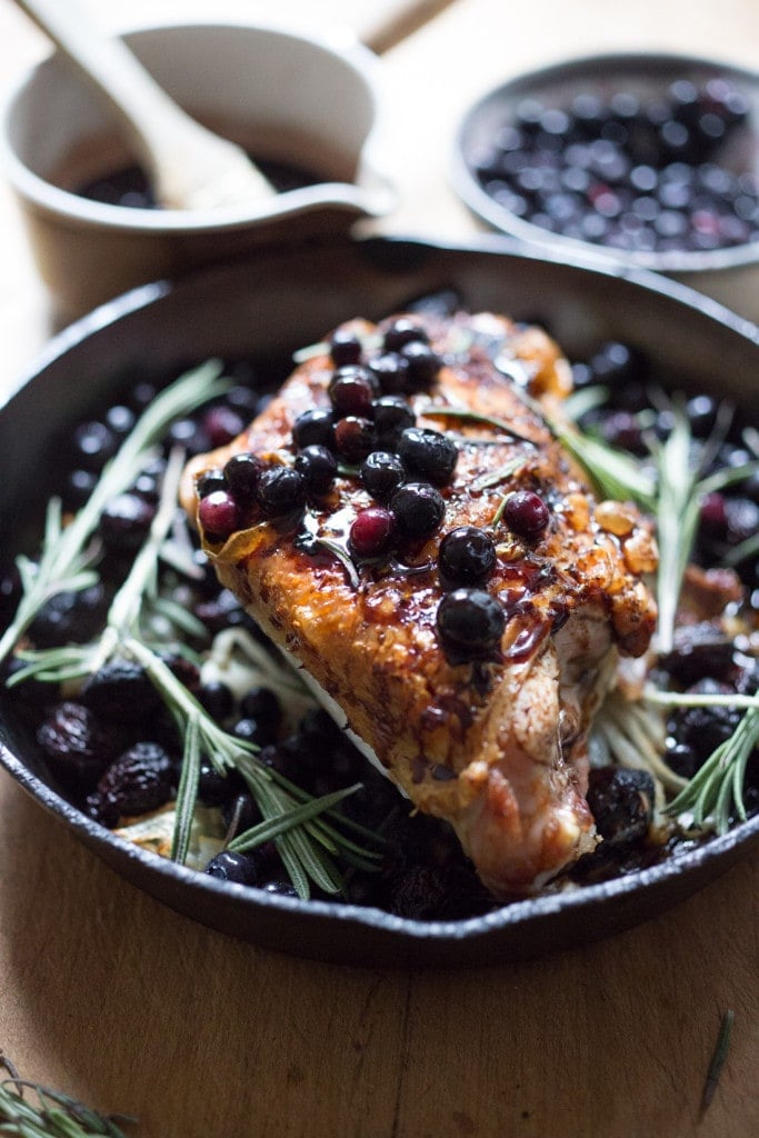 A delicious recipe for Roasted Turkey Breast with Blueberry Balsamic Glaze with whole grain mustard, dried figs, roasted blueberries and fresh rosemary sprigs. | www.feastingathome.com