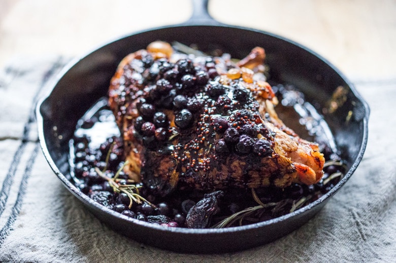 A delicious recipe for Roasted Turkey Breast with Blueberry Balsamic Glaze with whole grain mustard, dried figs, roasted blueberries and fresh rosemary sprigs. | www.feastingathome.com