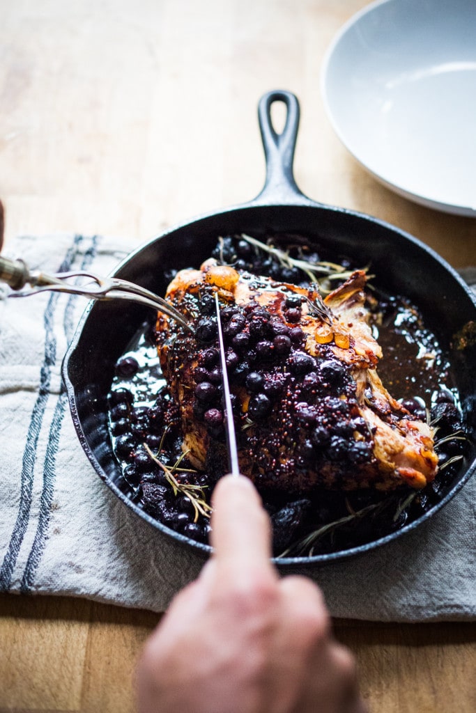 A delicious recipe for Roasted Turkey Breast with Blueberry Balsamic Glaze with whole grain mustard, dried figs, roasted blueberries and fresh rosemary sprigs. | www.feastingathome.com