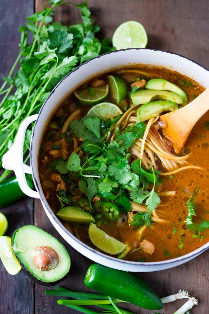 Flavorful, EASY Mexican Chicken Noodle Soup with cilantro, avocado and lime- a one pot meal, in under 30 minutes. Vegan option, sub chickpeas for the chicken!| www.feastingathome.com