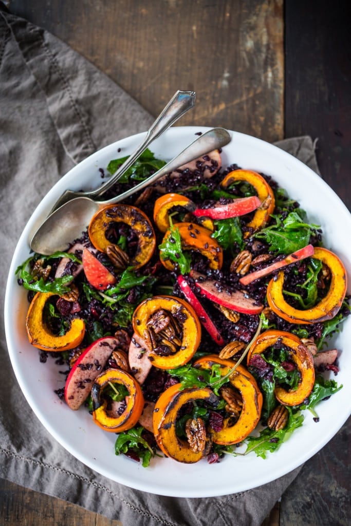 Maple-glazed Pecans, Dried Cranberries, and a vegan Maple Dressing.  #thanksgivingsalad #fallsalad #vegansalad #holidaysalad #pumpkin #wildricesalad #kalesalad #applesalad #thanksgiving #salad 