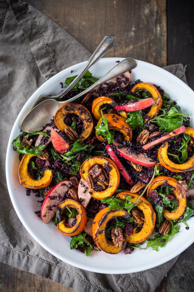 This delicious Thanksgiving Fall Salad with Roasted Pumpkin, Kale, Apples and Wild Rice, is topped with Maple glazed Pecans, Dried Cranberries, and a scrumptious, healthy, Allspice Vinaigrette. Vegan! #thanksgivingsalad #fallsalad #vegansalad #holidaysalad #pumpkin #wildricesalad #kalesalad #applesalad #thanksgiving #salad