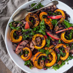 This delicious Thanksgiving Fall Salad with Roasted Pumpkin, Kale, Apples and Wild Rice, is topped with Maple glazed Pecans, Dried Cranberries, and a scrumptious, healthy, Allspice Vinaigrette. Vegan! #thanksgivingsalad #fallsalad #vegansalad #holidaysalad #pumpkin #wildricesalad #kalesalad #applesalad #thanksgiving #salad