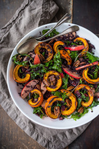 This delicious Thanksgiving Fall Salad with Roasted Pumpkin, Kale, Apples and Wild Rice, is topped with Maple glazed Pecans, Dried Cranberries, and a scrumptious, healthy, Allspice Vinaigrette. Vegan! #thanksgivingsalad #fallsalad #vegansalad #holidaysalad #pumpkin #wildricesalad #kalesalad #applesalad #thanksgiving #salad